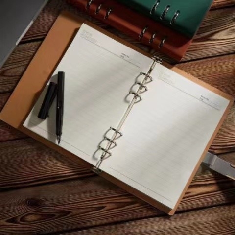 La aduana impresa corporativa de cuero de los cuadernos A5 del 14.3cm de los x 21.5cm imprimió las libretas
